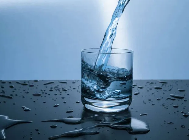 Clean water being poured into a glass